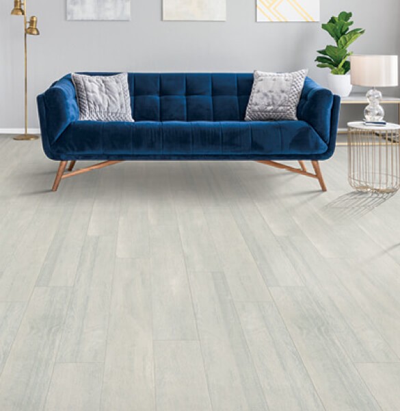 Blue couch on Laminate flooring | All Floors Design Centre