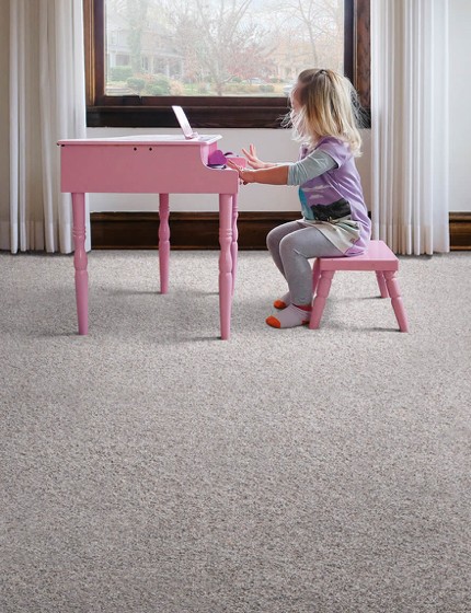 Girl with piano on Carpet flooring | All Floors Design Centre