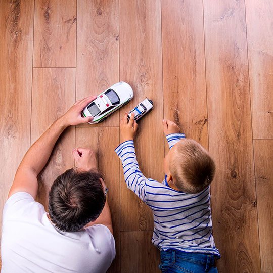 Father and kid playing with toycar | All Floors Design Centre