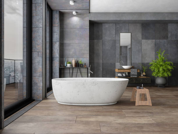 Bathroom tile dark flooring with bath tub | All Floors Design Centre