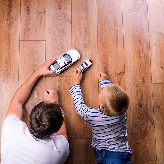 Father and kid playing with toycar | All Floors Design Centre